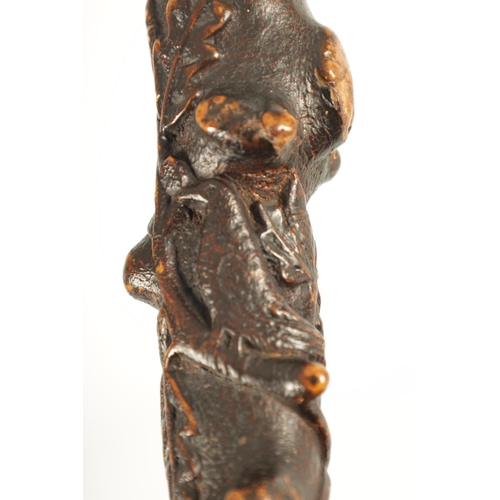 453 - A RARE 19TH CENTURY FOLK ART CARVED FRUITWOOD WALKING STICK with acorn and oak leaf carved decoratio... 