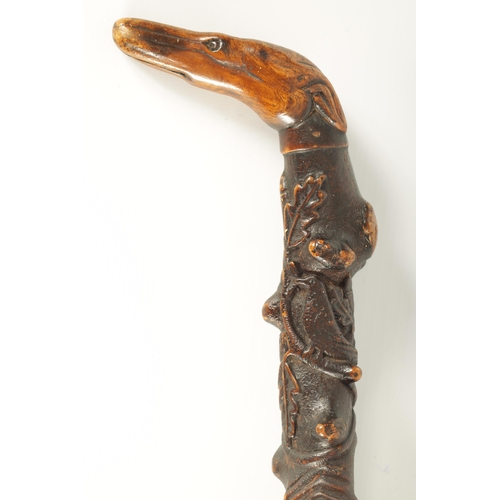 453 - A RARE 19TH CENTURY FOLK ART CARVED FRUITWOOD WALKING STICK with acorn and oak leaf carved decoratio... 