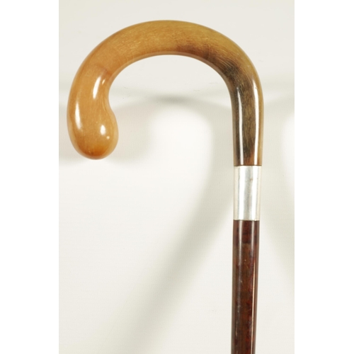 454 - AN EARLY 20TH CENTURY SILVER MOUNTED RHINOCEROS HORN HANDLED WALKING STICK the crook handle inlaid w... 