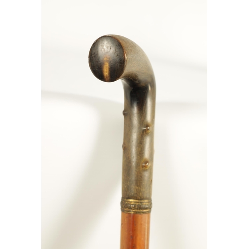 455 - A LATE 19TH CENTURY RHINOCEROS HORN HANDLED WALKING STICK the thick horn handle carved to simulate h... 