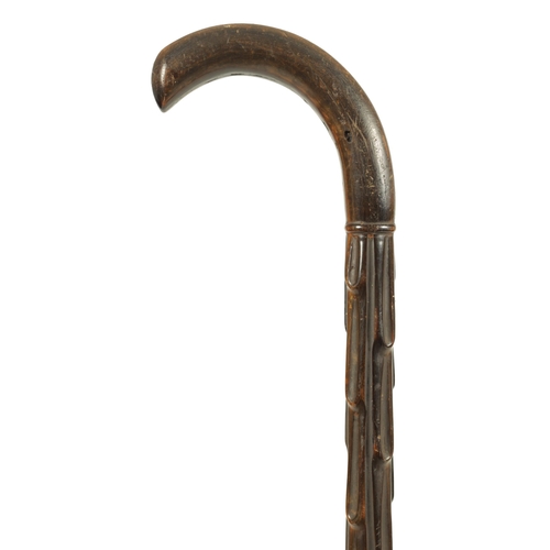 456 - A GOOD 19TH CENTURY RHINOCEROS HORN WALKING STICK with carved branchwork shaft and curved handle. (9... 