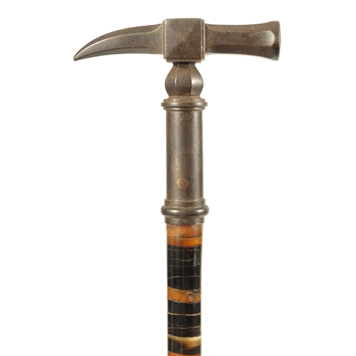 461 - A LATE 19TH CENTURY SEGMENTED HORN WALKING STICK WITH PATINATED METAL HAMMER HEAD HANDLE on a ringed... 