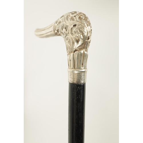 464 - TWO EARLY 20TH CENTURY SILVER MOUNTED PARASOLS one having an ebonised handle with carved bust of an ... 