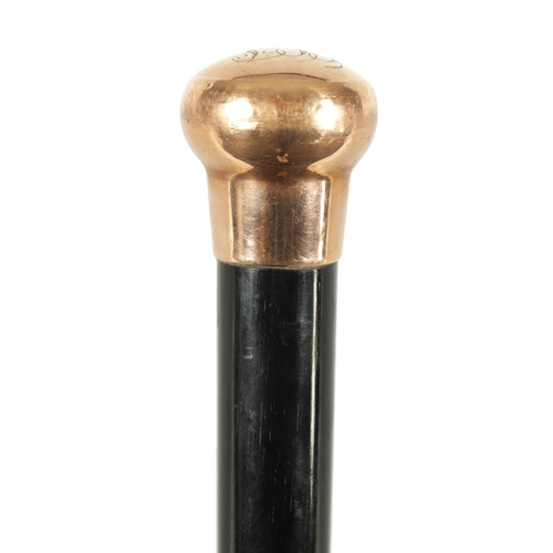 467 - A LATE 19TH CENTURY 9CT GOLD HANDLED WALKING STICK with ebonised tapering shaft - hallmarked .375 (8... 