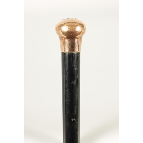 467 - A LATE 19TH CENTURY 9CT GOLD HANDLED WALKING STICK with ebonised tapering shaft - hallmarked .375 (8... 