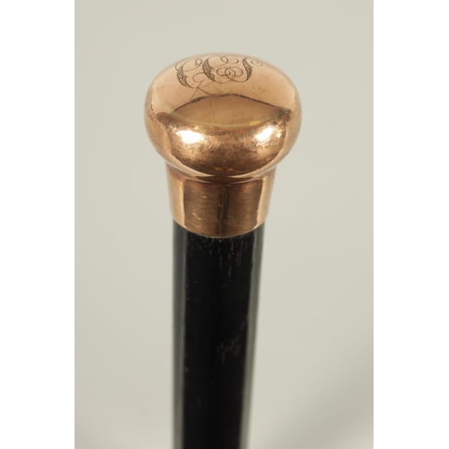 467 - A LATE 19TH CENTURY 9CT GOLD HANDLED WALKING STICK with ebonised tapering shaft - hallmarked .375 (8... 