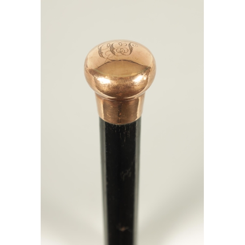 467 - A LATE 19TH CENTURY 9CT GOLD HANDLED WALKING STICK with ebonised tapering shaft - hallmarked .375 (8... 