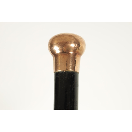 467 - A LATE 19TH CENTURY 9CT GOLD HANDLED WALKING STICK with ebonised tapering shaft - hallmarked .375 (8... 