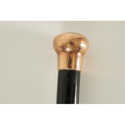 467 - A LATE 19TH CENTURY 9CT GOLD HANDLED WALKING STICK with ebonised tapering shaft - hallmarked .375 (8... 