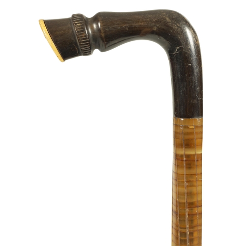 470 - A LATE 19TH CENTURY CONTINENTAL TWISTED SEGMENTED HORN HOOF HANDLED WALKING STICK (81cm overall)