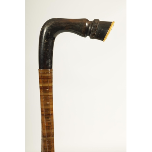 470 - A LATE 19TH CENTURY CONTINENTAL TWISTED SEGMENTED HORN HOOF HANDLED WALKING STICK (81cm overall)