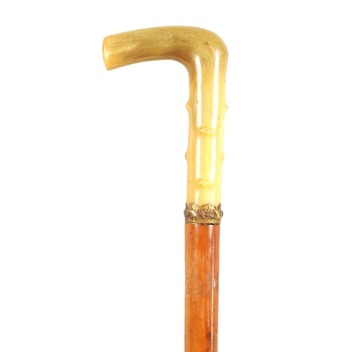 473 - A LATE 19TH CENTURY RHINOCEROS HORN HANDLED SWORD STICK the horn handle formed to simulate hawthorn ... 