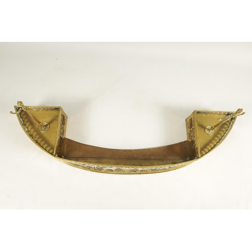 504 - A GEORGE III ADAM STYLE BOWFRONT BRASS HEARTH FENDER the shallow arched fret-cut gallery with winged... 