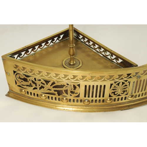 504 - A GEORGE III ADAM STYLE BOWFRONT BRASS HEARTH FENDER the shallow arched fret-cut gallery with winged... 