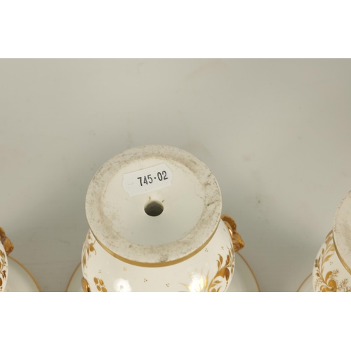 51 - A 19TH CENTURY SPODE TYPE THREE PIECE GARNITURE SET OF PORCELAIN VASES the gilt two-handled urn shap... 