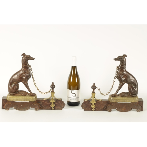 511 - A PAIR OF 19TH CENTURY CAST IRON AND BRASS MOUNTED HEARTH DOGS the seated hounds with decorated bodi... 