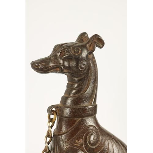 511 - A PAIR OF 19TH CENTURY CAST IRON AND BRASS MOUNTED HEARTH DOGS the seated hounds with decorated bodi... 