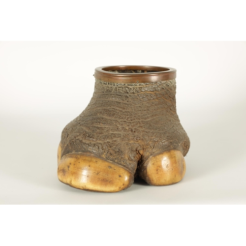 515 - A SMALL LATE 19TH CENTURY TAXIDERMY ELEPHANT FOOT with mounted copper rim (18cm high)