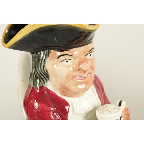 52 - A 19TH CENTURY DAVENPORT POLYCHROME TOBY JUG with hat cover and depicting a seated gentleman holding... 