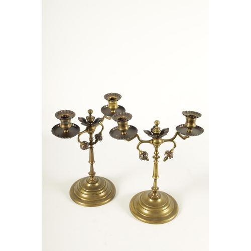 521 - ATTRIBUTED TO WILLIAM ARTHER SMITH BENSON, A STYLISH PAIR OF ARTS AND CRAFTS PATINATED COPPER AND BR... 