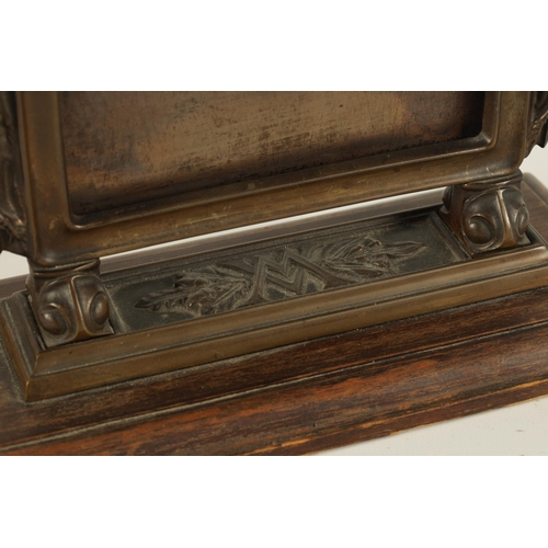 528 - A STYLISH ARTS AND CRAFTS BRONZE CARD DISPLAY STAND the moulded frame with locust sides on leaf cast... 