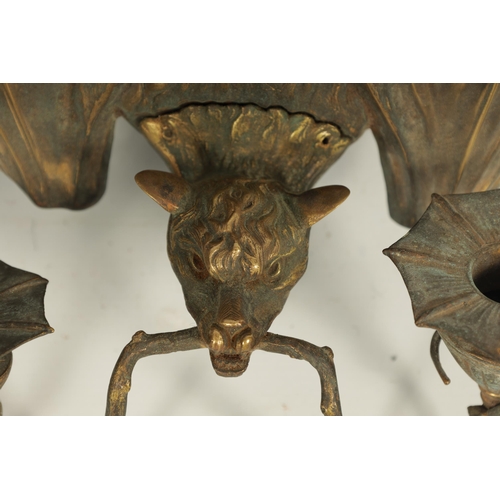 529 - A PAIR OF BRONZE HANGING BAT WALL SCONCES AFTER WILLIAM TONKS & SONS FOR LIBERTY'S designed at the K... 