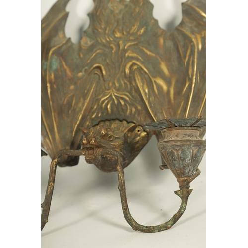 529 - A PAIR OF BRONZE HANGING BAT WALL SCONCES AFTER WILLIAM TONKS & SONS FOR LIBERTY'S designed at the K... 