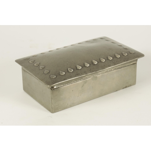 530 - A LIBERTY STYLE ARTS AND CRAFTS RECTANGULAR PEWTER CIGARETTE BOX the planished cushion shaped lid wi... 