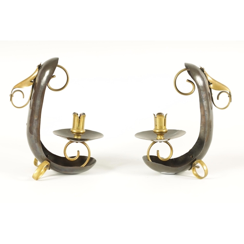 537 - ATTRIBUTED TO WILLIAM ARTHUR SMITH BENSON A STYLISH PAIR OF ARTS AND CRAFTS PATINATED COPPER AND BRA... 