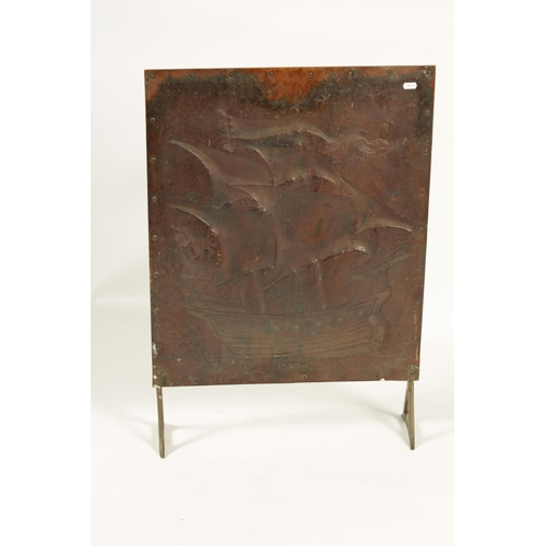 538 - AN ARTS AND CRAFTS COPPER FIRE SCREEN IN THE MANNER OF NEWLYN SCHOOL depicting a sailing ship within... 