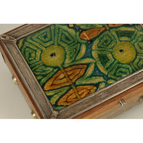 539 - A 20TH CENTURY ARTS AND CRAFT STYLE SILVER MOUNTED AND ENAMEL WORK WALNUT JEWELLERY BOX the textured... 