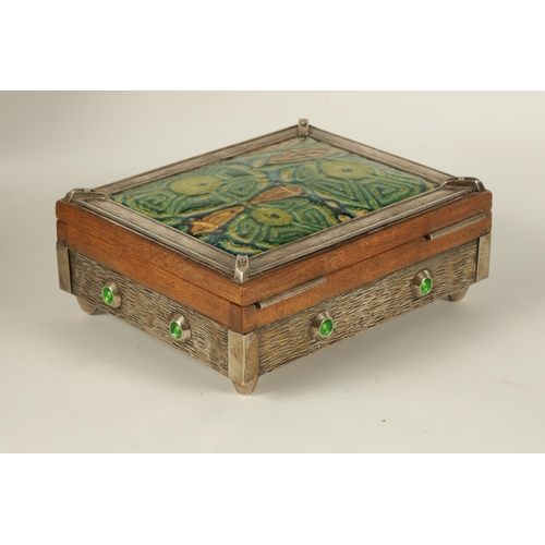 539 - A 20TH CENTURY ARTS AND CRAFT STYLE SILVER MOUNTED AND ENAMEL WORK WALNUT JEWELLERY BOX the textured... 