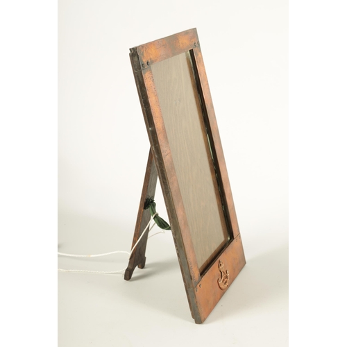 542 - AN ARTS AND CRAFTS LIBERTY STYLE RECTANGULAR PLANISHED COPPER PHOTOGRAPH FRAME the riveted joined fr... 