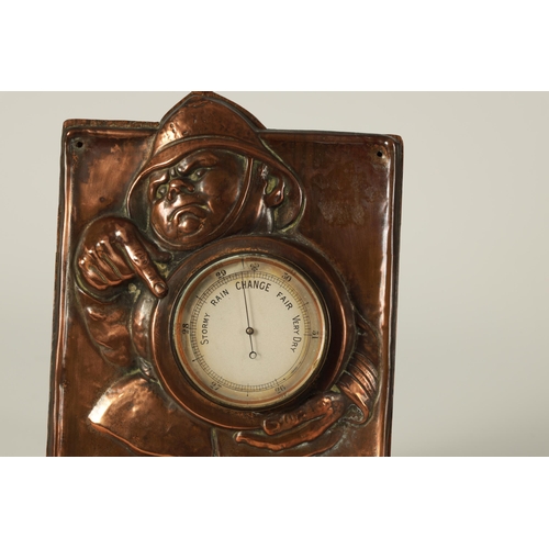 543 - AN ARTS AND CRAFTS COPPER NOVELTY DESK BAROMETER DEPICTING A FIREMAN designed by John Hassel, enclos... 