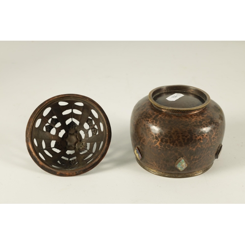 546 - AN ARTS AND CRAFTS ARTISTS GUILD PLANISHED COPPER POT-POURI BOWL AND COVER the footed rounded body s... 