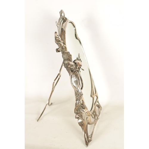 547 - AN ART NOVEAU WMF SILVER PLATED DRESSING TABLE MIRROR of shaped form with figural leaf and floral fr... 