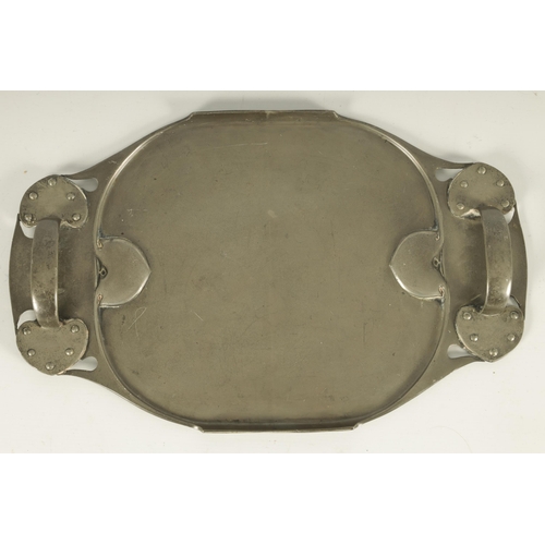 548 - A STYLISH LIBERTY TUDRIC PEWTER TWO-HANDLED OVAL TRAY with riveted and pierced shaped sides enclosin... 