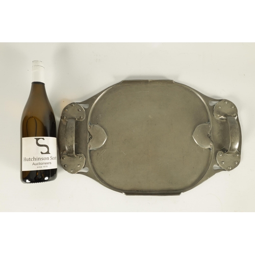 548 - A STYLISH LIBERTY TUDRIC PEWTER TWO-HANDLED OVAL TRAY with riveted and pierced shaped sides enclosin... 