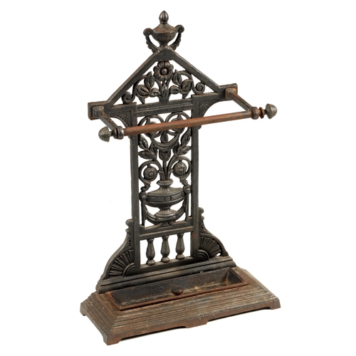 549 - A LATE 19TH CENTURY CAST IRON COALBROOKDALE STYLE UMBRELLA/STICK STAND with rectangular stepped tray... 