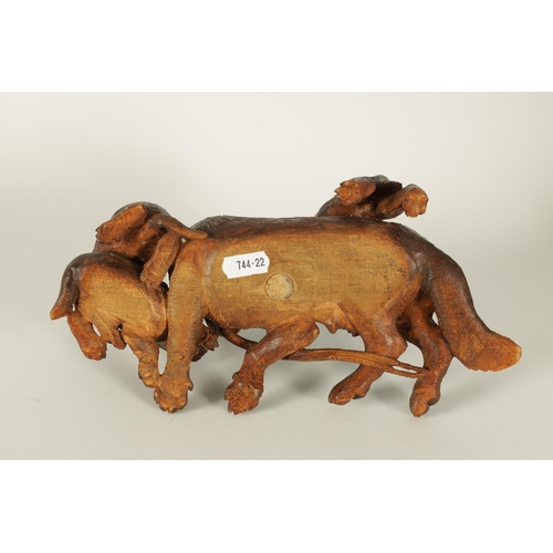 554 - A FINE 19TH CENTURY BLACK FOREST CARVED LINDEN-WOOD ANIMAL GROUP depicting a recumbent Dog with Pups... 