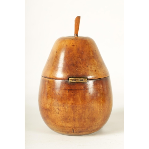 556 - A 19TH CENTURY STYLE FRUITWOOD TEA CADDY modelled as a pear with locking hinged lid and foil lined i... 