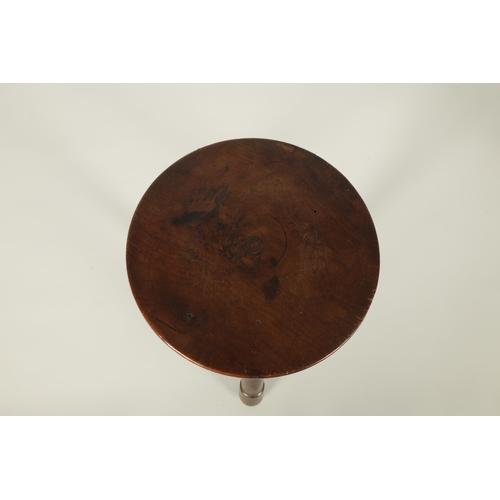 559 - AN EARLY/MID 19TH CENTURY YEW WOOD LOW STOOL the ribbed circular top on three ringed turned splay le... 