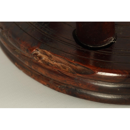 559 - AN EARLY/MID 19TH CENTURY YEW WOOD LOW STOOL the ribbed circular top on three ringed turned splay le... 