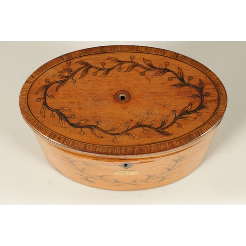 560 - A GEORGE III INLAID SATINWOOD OVAL SHAPED TEA CADDY with crossbanded edges and branchwork inlays. (1... 