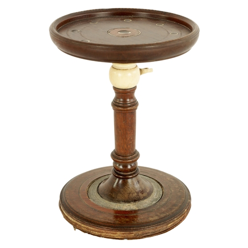 561 - AN 18TH CENTURY MAHOGANY ADJUSTABLE CANDLE STAND with inlaid ivory decorated top and turned stem wit... 