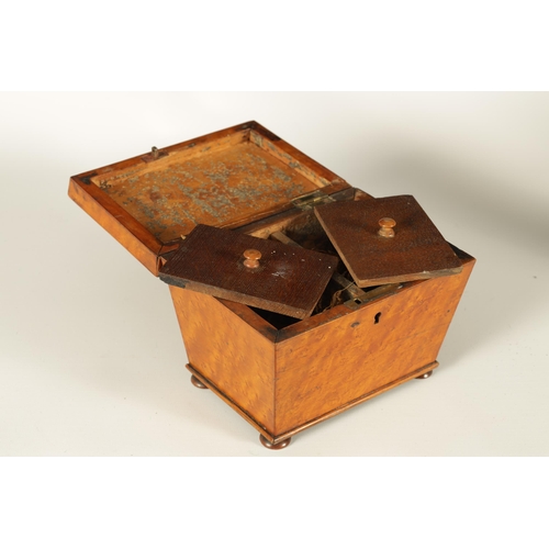 563 - A LATE GEORGIAN BURR MAPLE SARCOPHAGUS TEA CADDY the chamfered lid enclosing a divided lidded interi... 