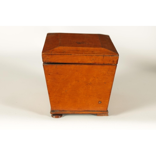 563 - A LATE GEORGIAN BURR MAPLE SARCOPHAGUS TEA CADDY the chamfered lid enclosing a divided lidded interi... 