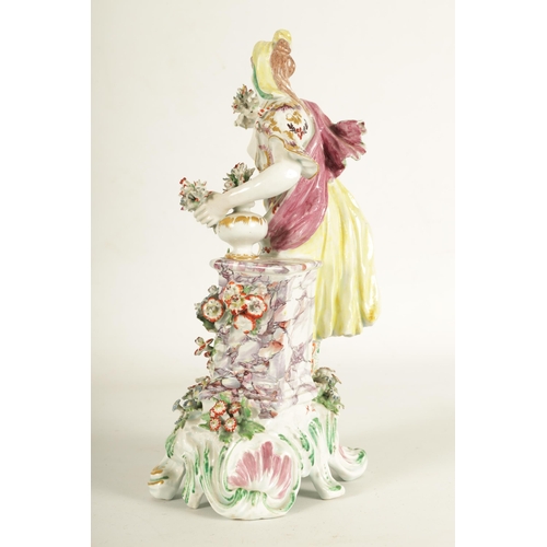 57 - AN 18TH CENTURY BOW PORCELAIN STANDING FIGURE OF FLORA finely modelled with encrusted floral decorat... 