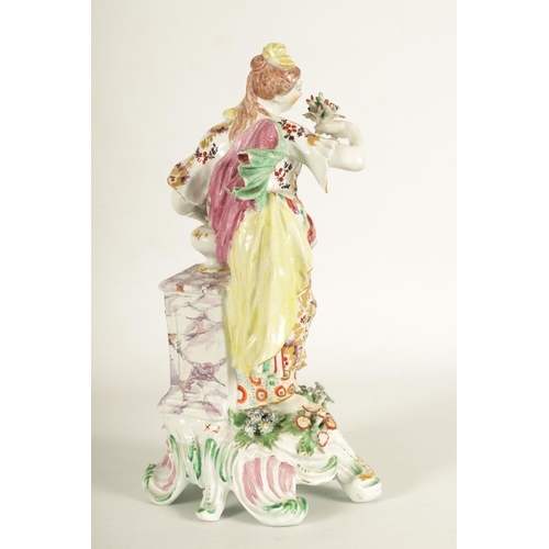 57 - AN 18TH CENTURY BOW PORCELAIN STANDING FIGURE OF FLORA finely modelled with encrusted floral decorat... 