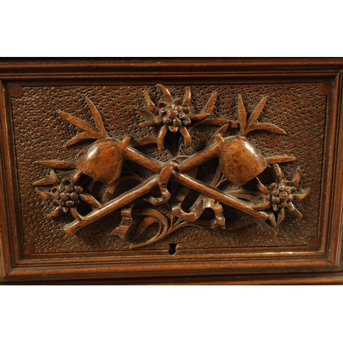 573 - A 19TH CENTURY CARVED BLACK FOREST CIGAR BOX the box surmounted by a carved deer on naturalistic bas... 